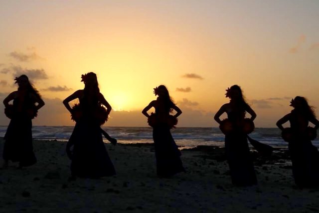 girls learning the hula on a lawn