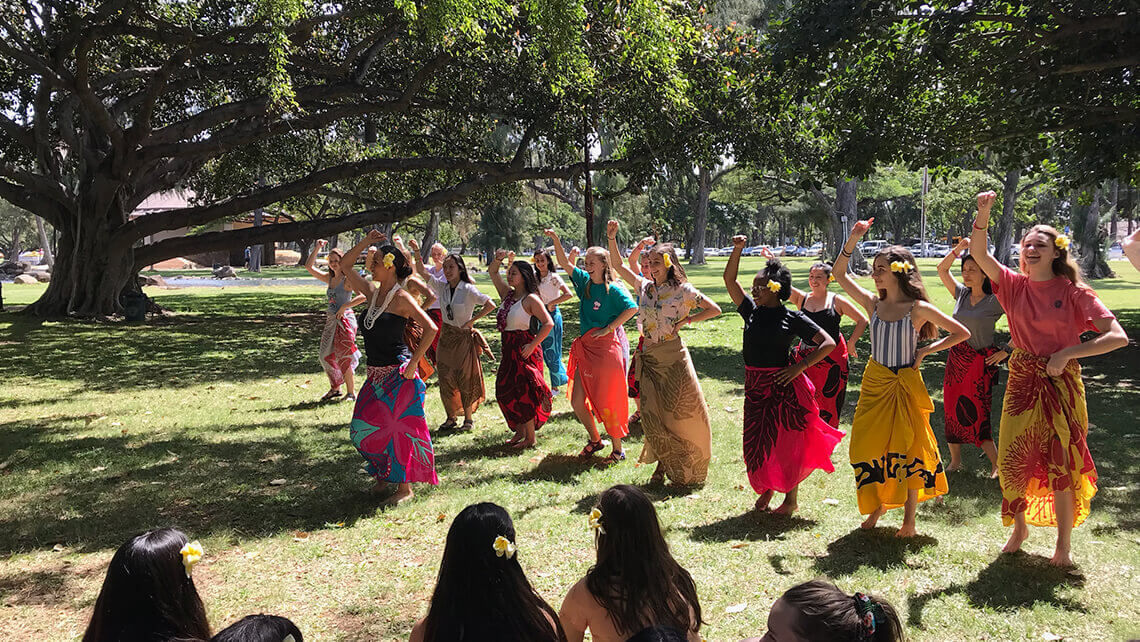 group learning how to hula in hawaii