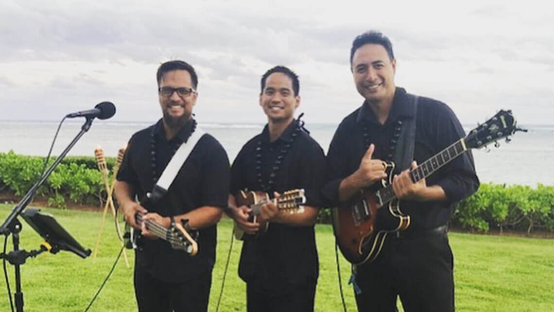 hawaiian musicians in matching aloha shirt