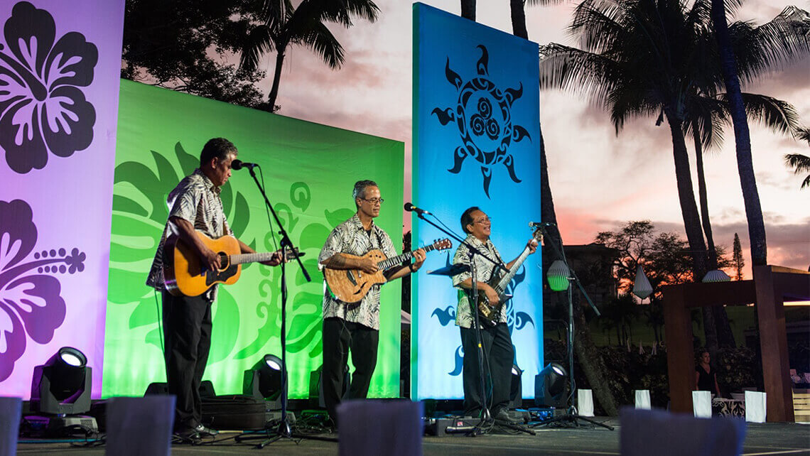 hawaiian musicians in matching aloha shirt