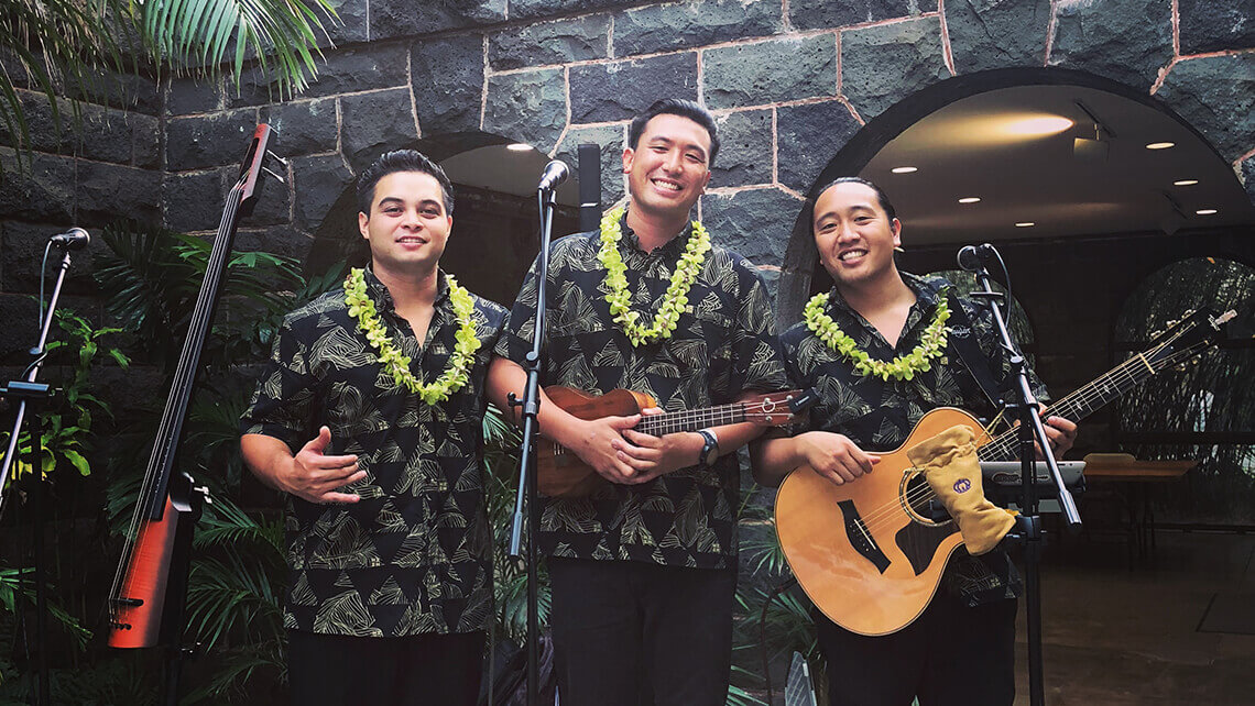 hawaiian musicians in matching aloha shirt