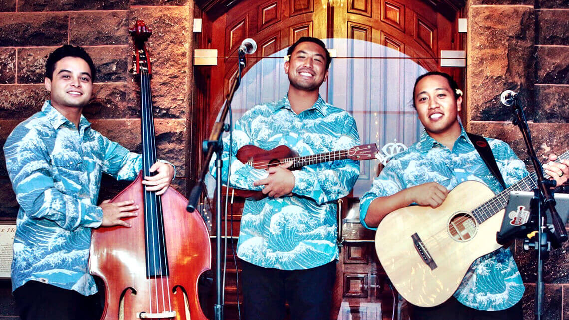 hawaiian musicians in matching aloha shirt