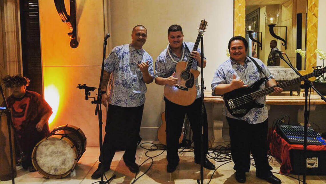 hawaiian musicians doing the shaka hadn signal