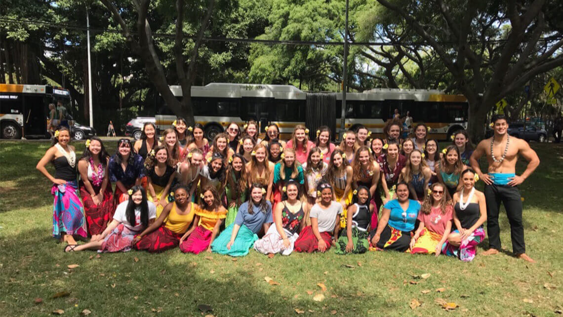 large group wearing hawaiin wraps after hula dancing with Hawaiʻi Hula Company