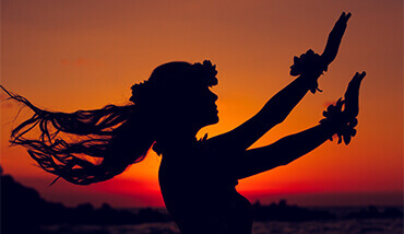 silhouette of hawaiian hula dancer in sunset