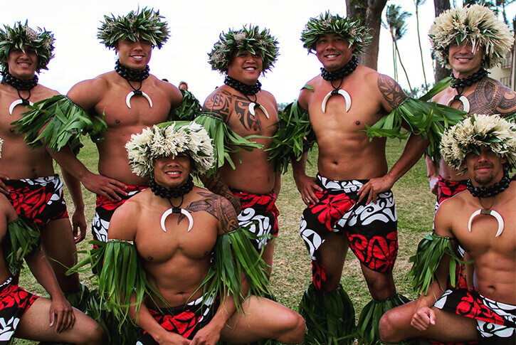 male hula dancers in traditional costume