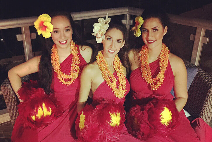 hula dancers in traditional costume