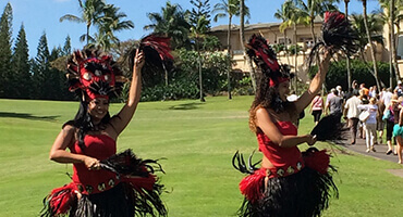 hula dancers performing outdoor on grass