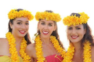 hula girls wearing hawaiian lei